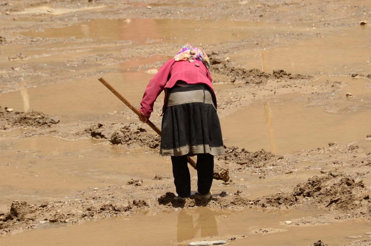 16 Woman Tilling A Wet Field In Yilik Village On The Way To K2 China Trek